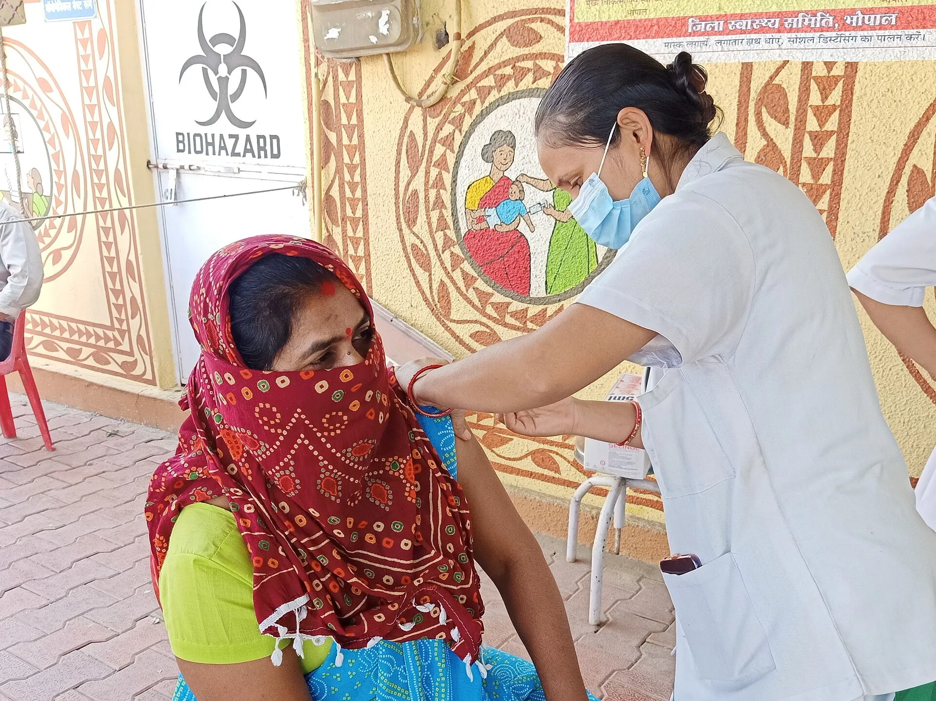 People at a COVID-19 vaccination drive in Bhopal