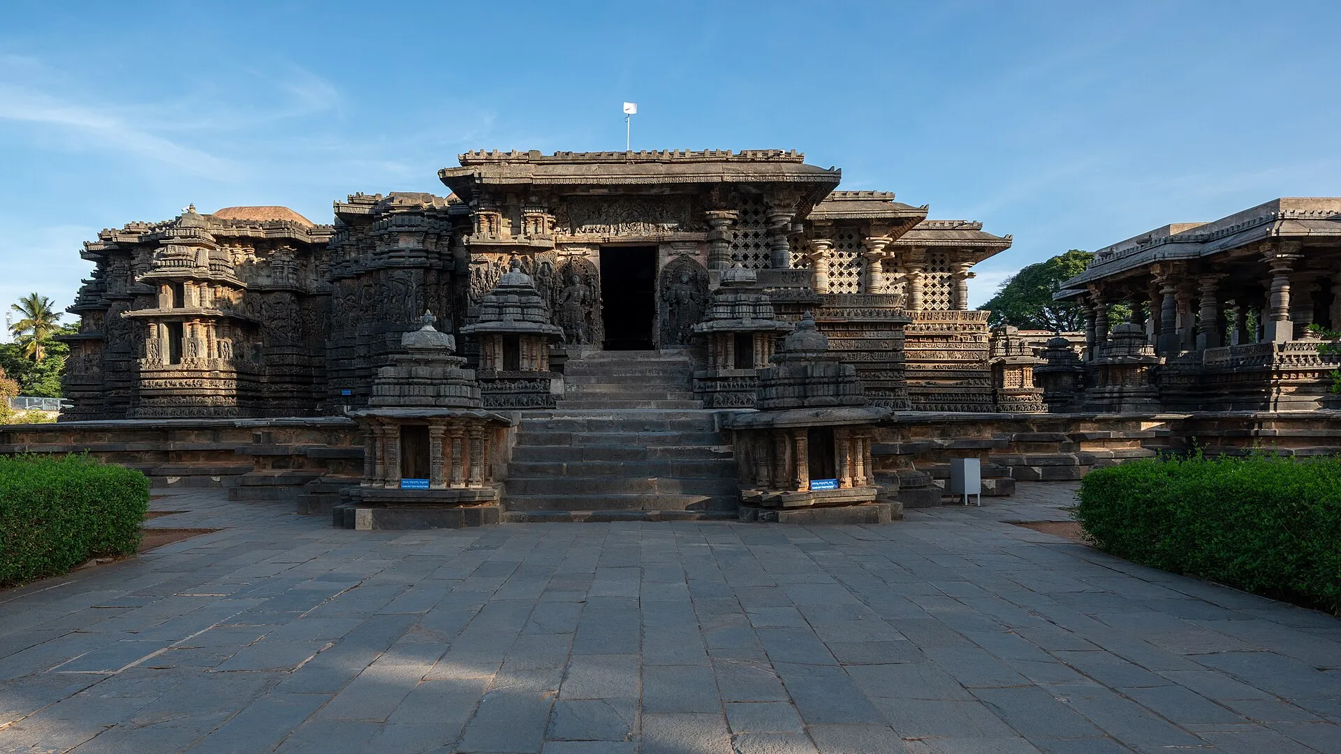 The Hoysaleswara Temple at Halebidu, its low star-shaped walls covered in carved friezes