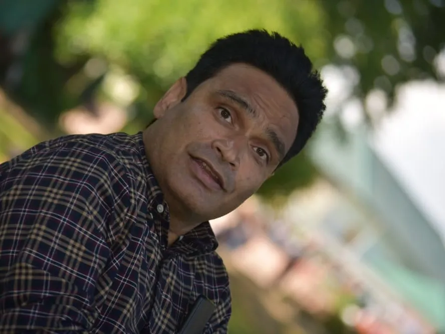 Portrait of Javed Ahmad Tak outdoors