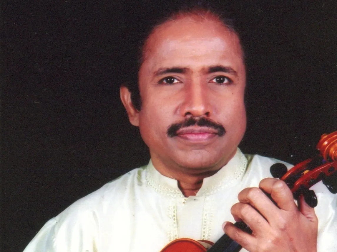 L. Subramaniam holding his violin